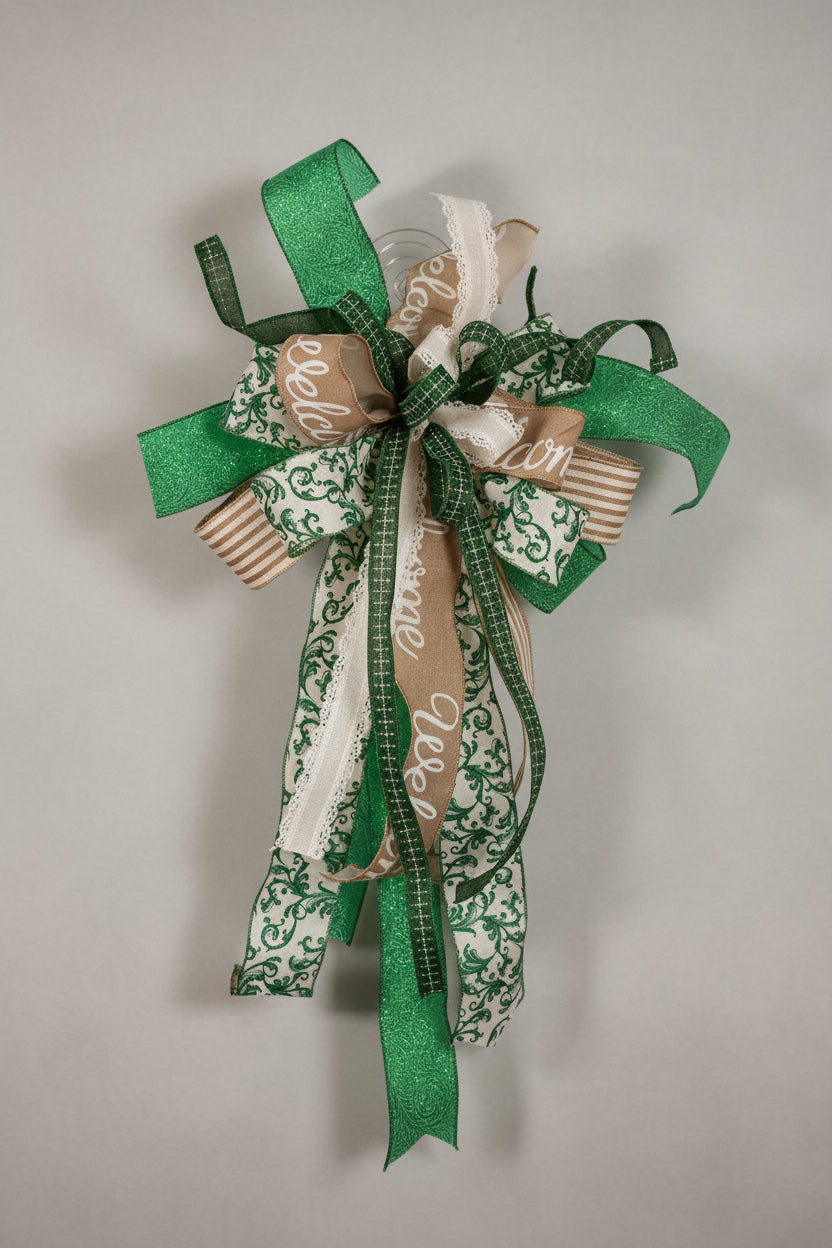 Full view of Emerald Chinoiserie Welcome bow with emerald, copper stripe and cream lace ribbons