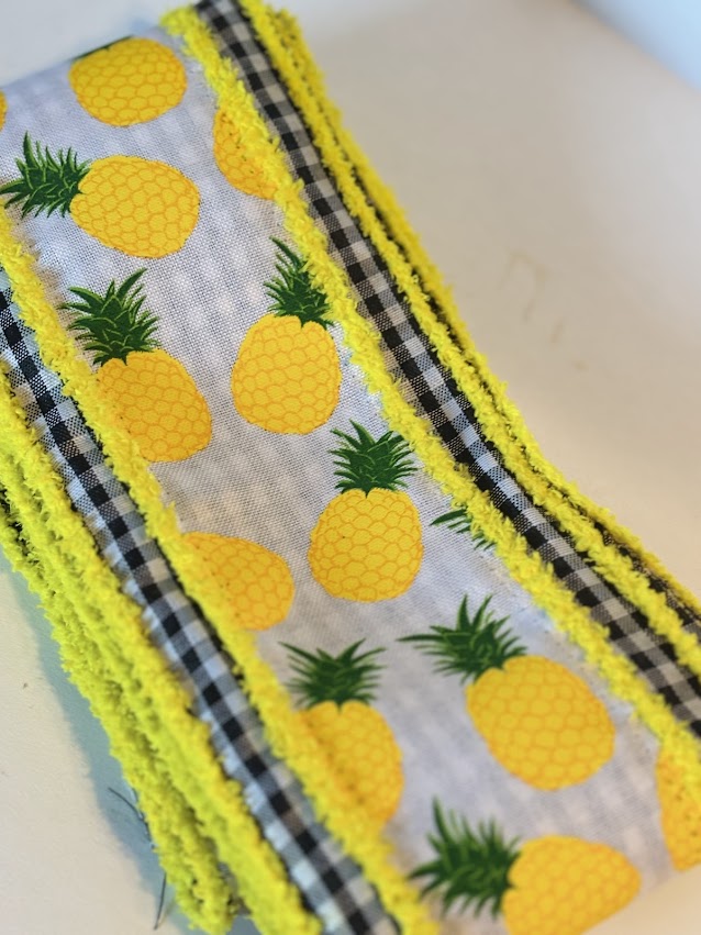 4 inch pineapple wired ribbon with black and white gingham trim and yellow wired edges