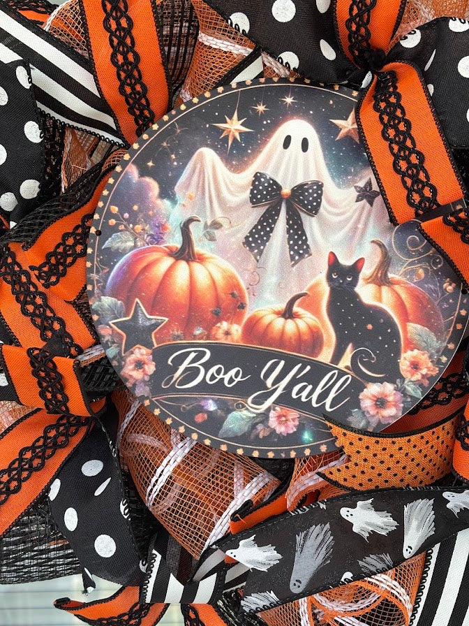 Boo Y'all sign closeup with pumpkins, black cat, and ghosts